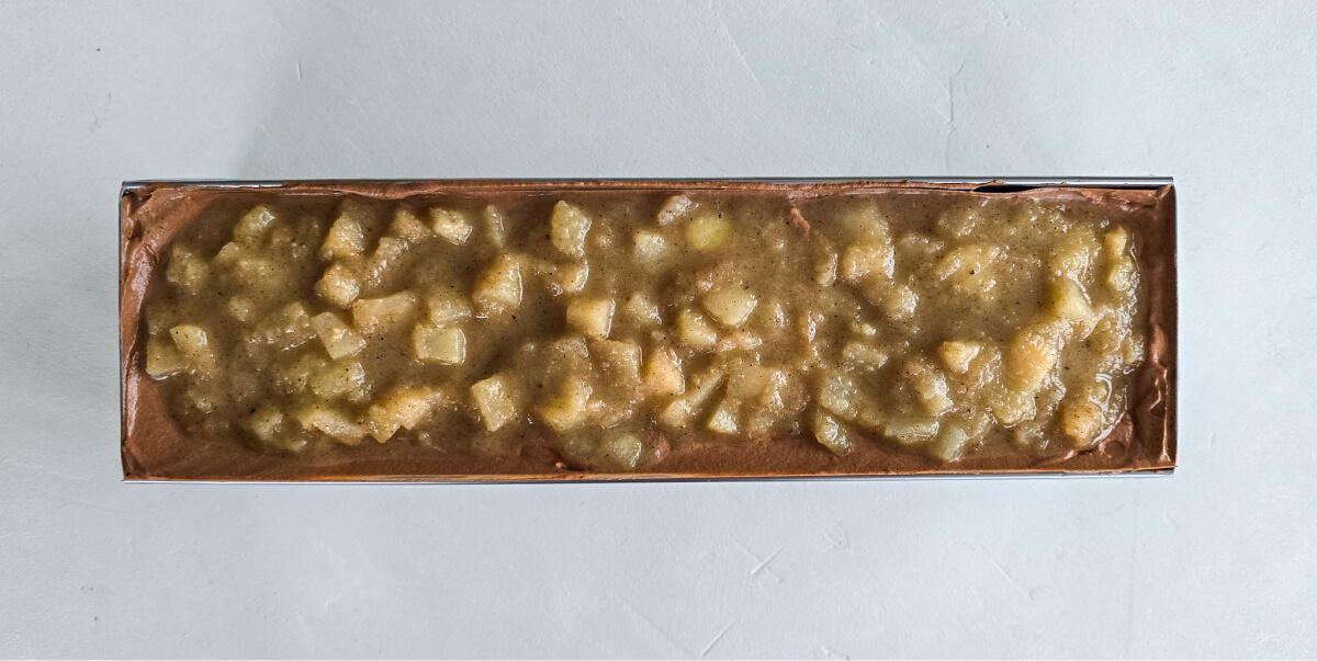 Caramelized pear compote preparation placed inside the pear caramel yule log mold.